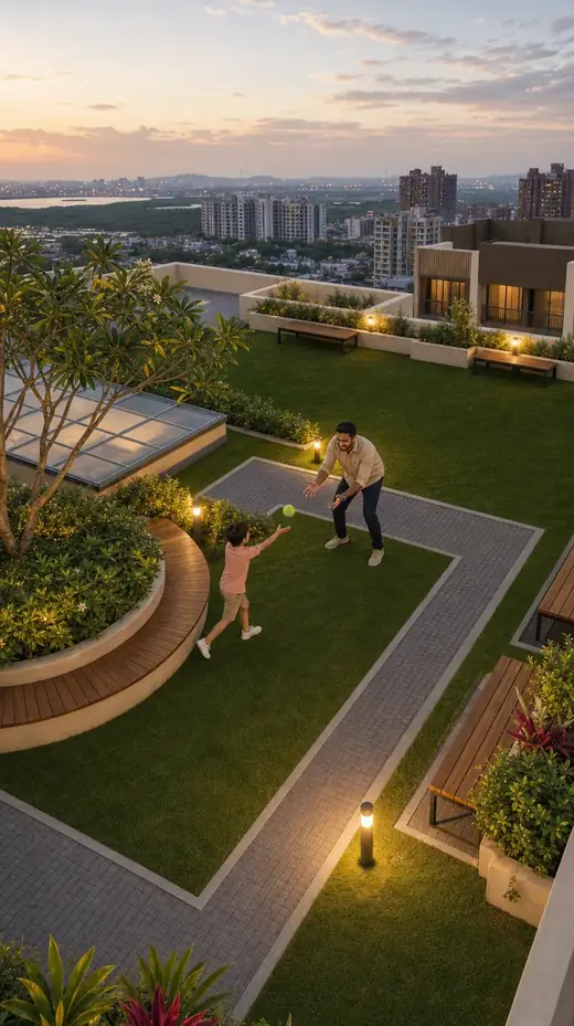 A father and child playing catch on the roof garden lawn at North ONE in the evening